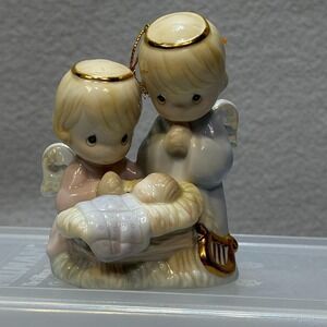 Precious Moments Ornament Angels praying over Baby Jesus 1997 Nativity Themed